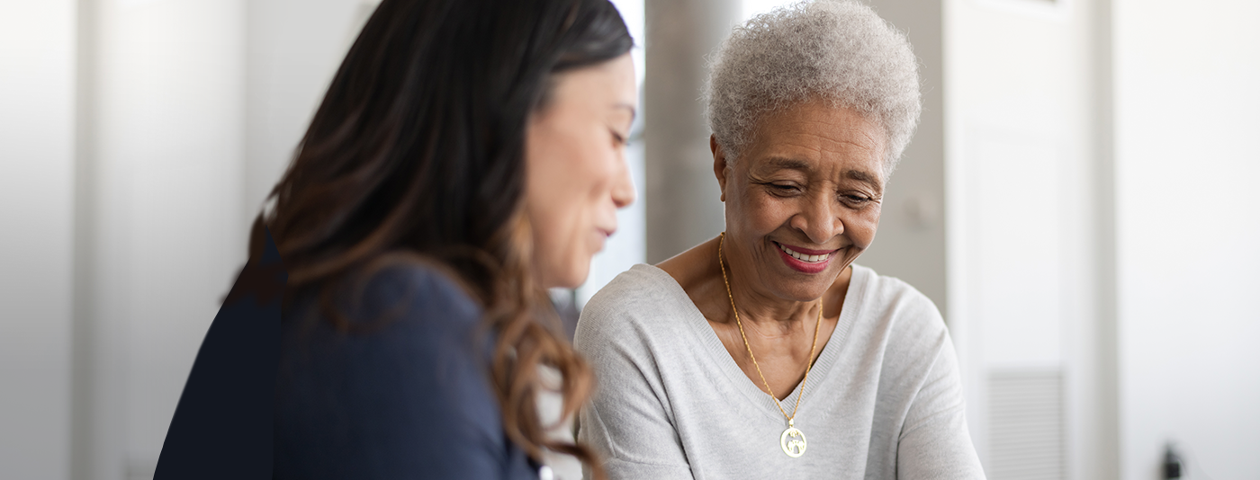 woman hugging senior